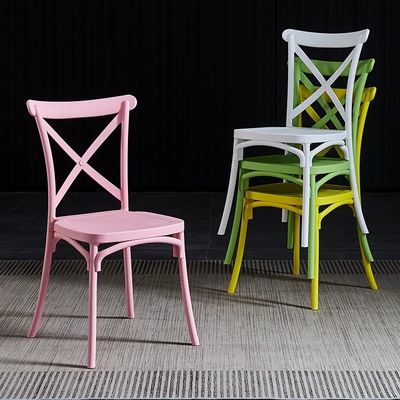 Buy Hotel Wedding Event PP Pink Plastic Dining Chairs Stackable Customized X Cross Back online manufacture