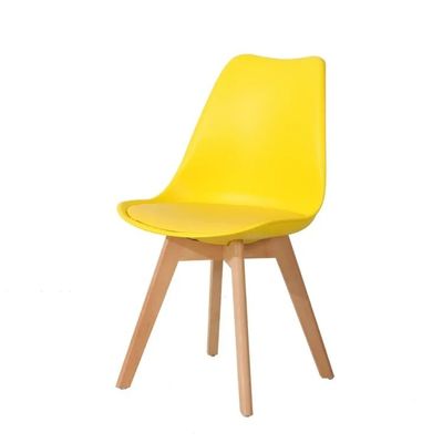 Buy Yellow Upholstered Leather Dining Chairs PP Plastic Modern Dining Chairs With Wood Legs online manufacture
